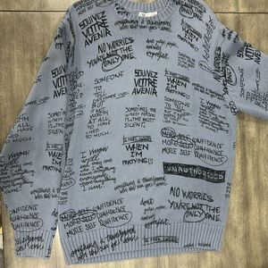 Knit crewneck with words/phrases as design